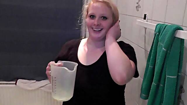 Pissing in jug- drinks and pours it on herself