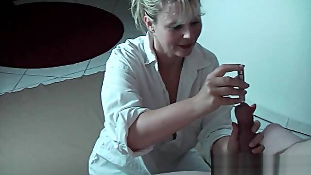 Sexy MILF gives sounding handjob