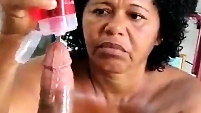 Voluptuous ebony granny jerks off a big black cock in POV