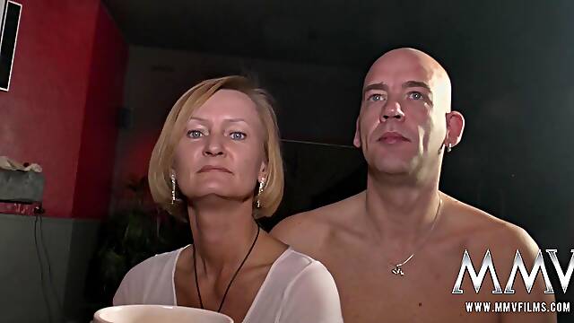 The horny swingers grab a drink at the bar before going into the fuck chamber.