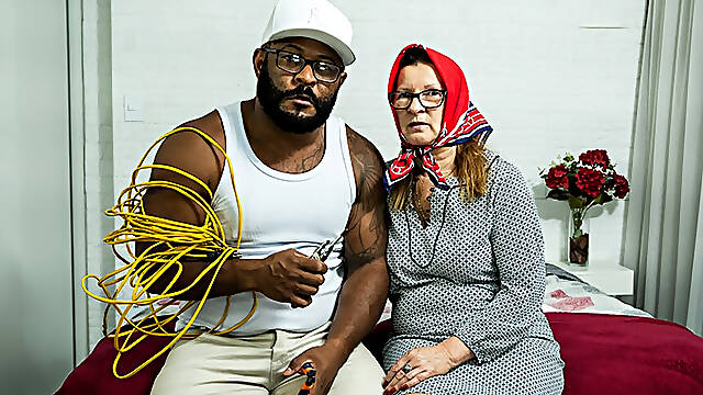 Old but still eager, black grandma gets her deep ass fucked by a horny electrician