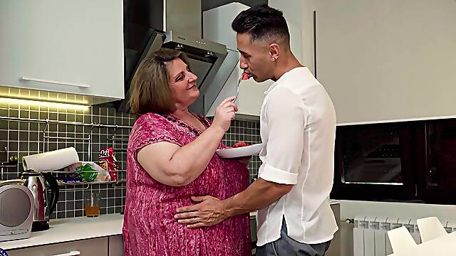 Chubby old slut smashes cock in her generous cunt