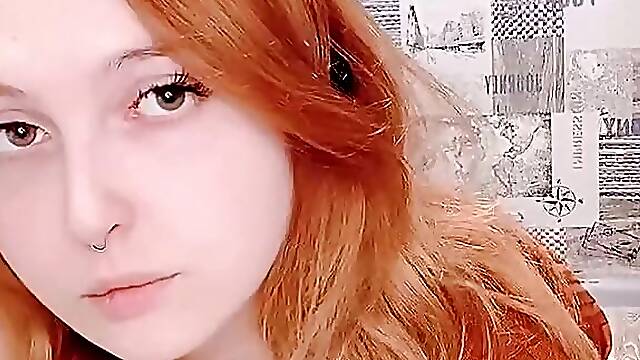 Red-haired juicy babe in a sexy dress