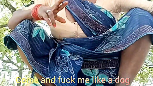 Asking pleasure outdoor in the farm sitting wearing saree .
