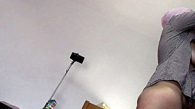 Amateur wife dancing naked at home. Amateur woman has fun trying on clothes and cutting them.