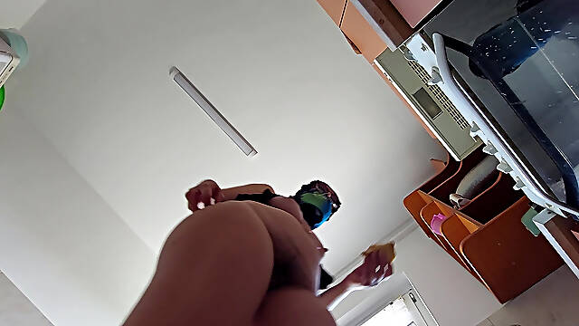 Sexy wife prepares breakfast naked in the kitchen.