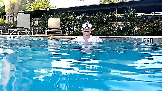 Couple Underwater Diving and Swimming