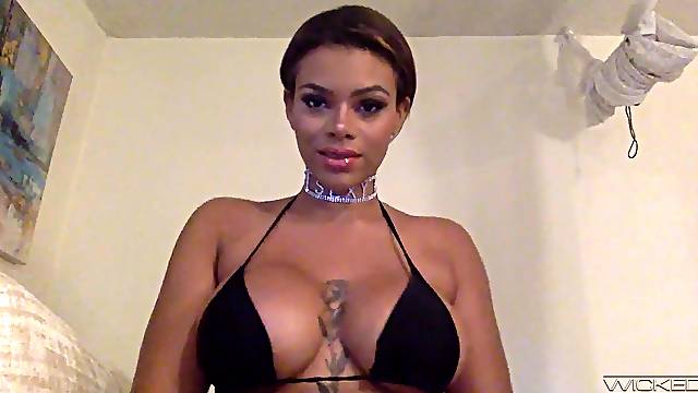 Busty ebony slut Halle Hayes sucks a large dildo while home alone