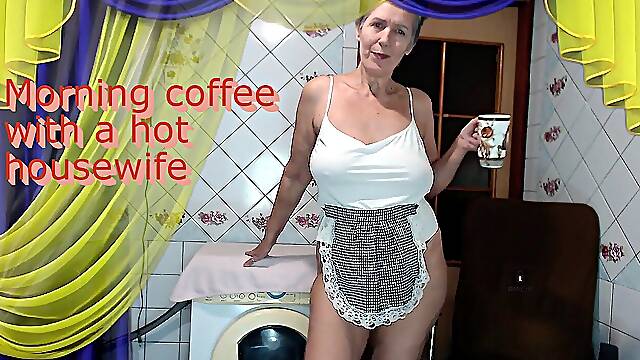 Morning Coffee with a Cheerful Hot Housewife Chatting with Fans Over a Cup of Coffee While...